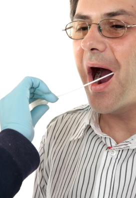 picture of obtaining a mouth swab from a man